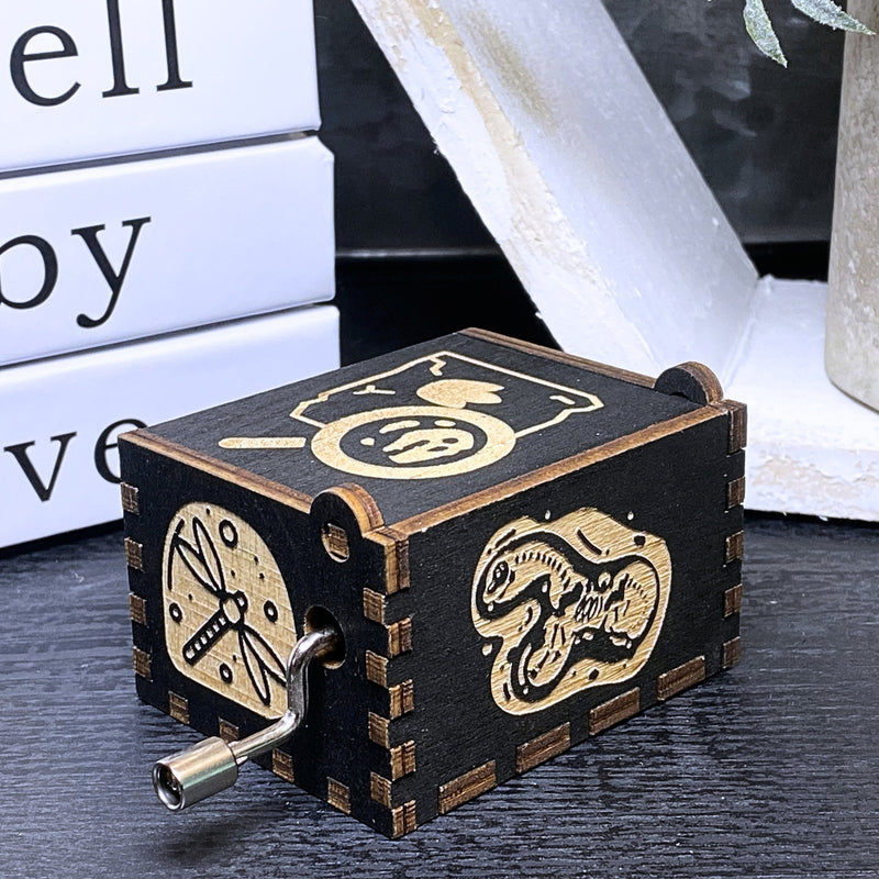 Load image into Gallery viewer, Jurassic Park: Join Alan Grant, Ellie Sattler, and Ian Malcolm on a tour of an island theme park filled with genetically resurrected dinosaurs. Get ready for an adventure with our iconic music box by MarketPlaceFad - Malaura Ashley.

