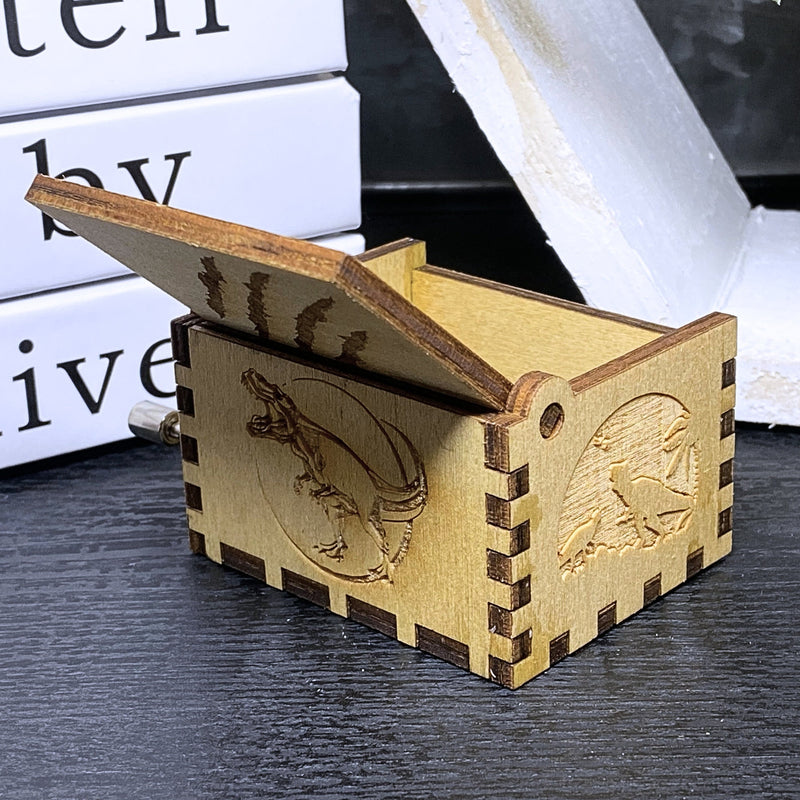 Load image into Gallery viewer, Jurassic Park: Join Alan Grant, Ellie Sattler, and Ian Malcolm on a tour of an island theme park filled with genetically resurrected dinosaurs. Get ready for an adventure with our iconic music box by MarketPlaceFad - Malaura Ashley.
