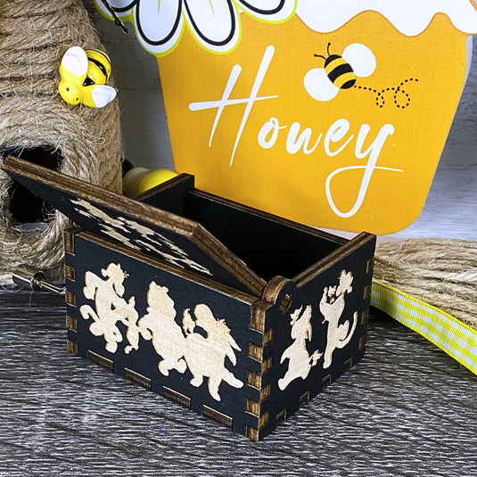 Embark on an adventure with classic Winnie-the-Pooh characters - Christopher Robin, Tigger, Piglet, Roo, and Eeyore - this exceptional music box lets you share these beautiful qualities with your loved one, buy one today!