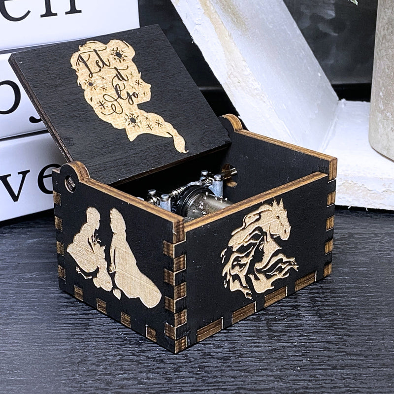 Load image into Gallery viewer, The film&#39;s captivating storyline, combined with the unforgettable song &quot;Let It Go,&quot; never fails to leave a lasting impression on anyone who watches. A delightful music box is available, allowing you to relive the magic wherever you go!
