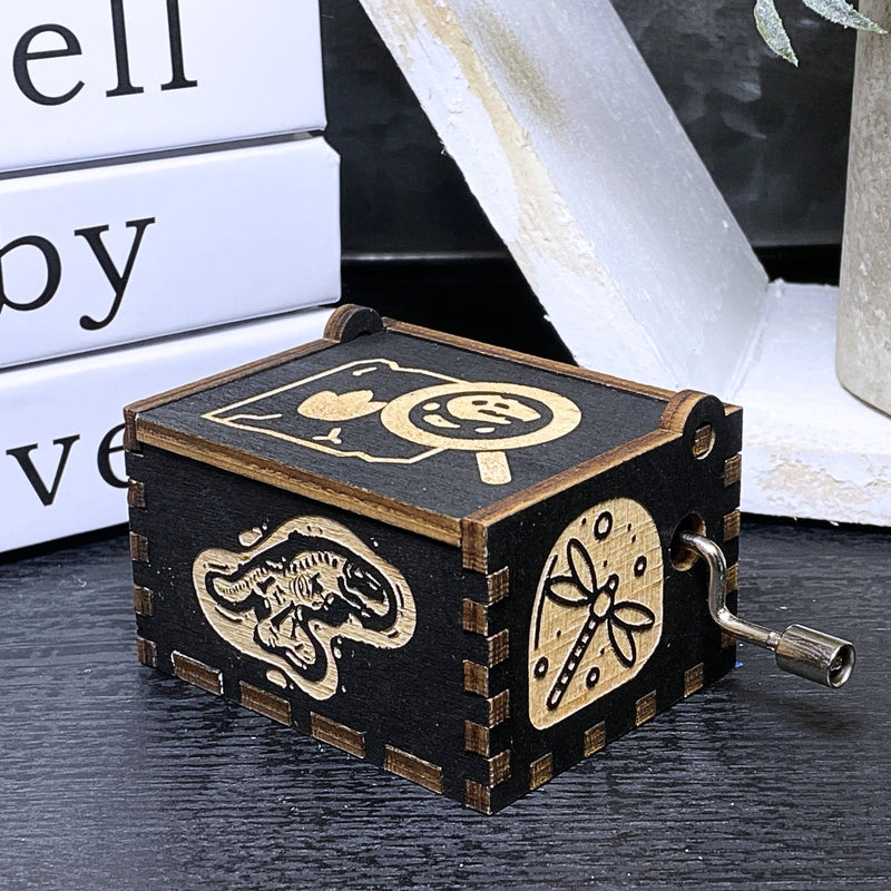 Load image into Gallery viewer, Jurassic Park: Join Alan Grant, Ellie Sattler, and Ian Malcolm on a tour of an island theme park filled with genetically resurrected dinosaurs. Get ready for an adventure with our iconic music box by MarketPlaceFad - Malaura Ashley.
