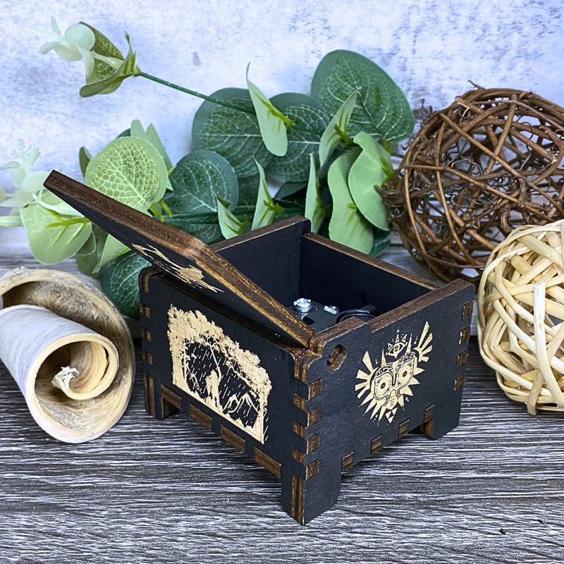 Load image into Gallery viewer, Are you looking for a one-of-a-kind gift for someone who adores Zelda? If so, you must check out the wooden music boxes at MarketPlacefad. These boxes are not just a source of melodious tunes but a work of art, handcrafted with attention to detail.
