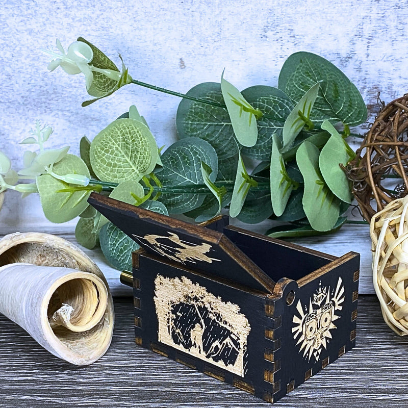 Load image into Gallery viewer, Are you looking for a one-of-a-kind gift for someone who adores Zelda? If so, you must check out the wooden music boxes at MarketPlacefad. These boxes are not just a source of melodious tunes but a work of art, handcrafted with attention to detail.
