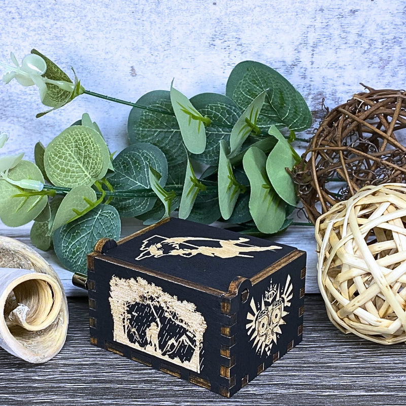 Load image into Gallery viewer, Are you looking for a one-of-a-kind gift for someone who adores Zelda? If so, you must check out the wooden music boxes at MarketPlacefad. These boxes are not just a source of melodious tunes but a work of art, handcrafted with attention to detail.
