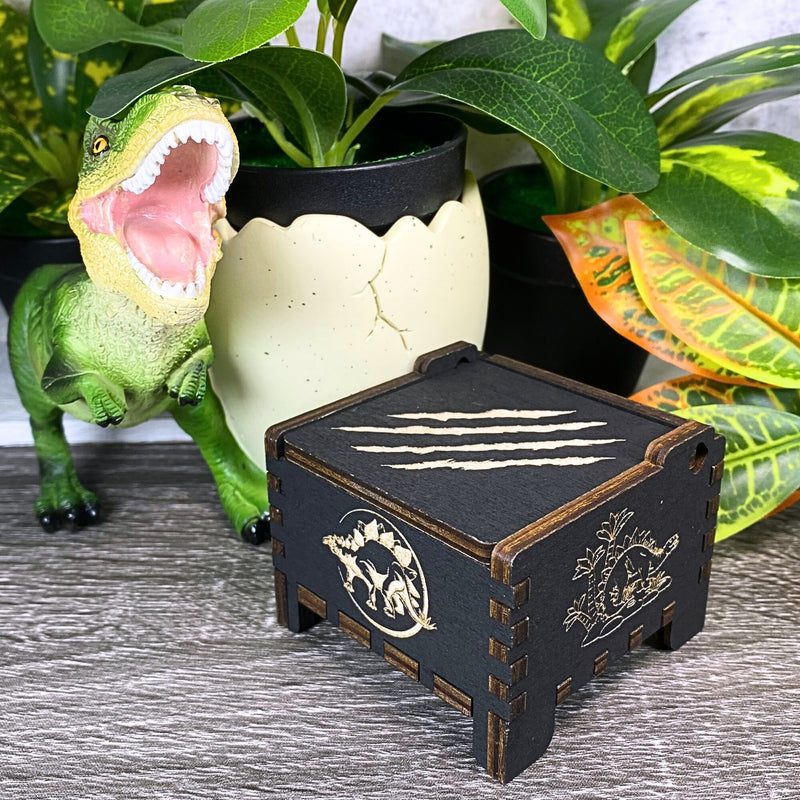 Load image into Gallery viewer, Jurassic Park: Join Alan Grant, Ellie Sattler, and Ian Malcolm on a tour of an island theme park filled with genetically resurrected dinosaurs. Get ready for an adventure with our iconic music box by MarketPlaceFad - Malaura Ashley.
