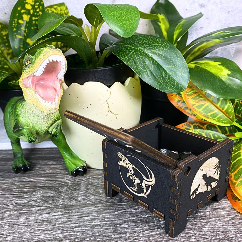 Load image into Gallery viewer, Jurassic Park: Join Alan Grant, Ellie Sattler, and Ian Malcolm on a tour of an island theme park filled with genetically resurrected dinosaurs. Get ready for an adventure with our iconic music box by MarketPlaceFad - Malaura Ashley.
