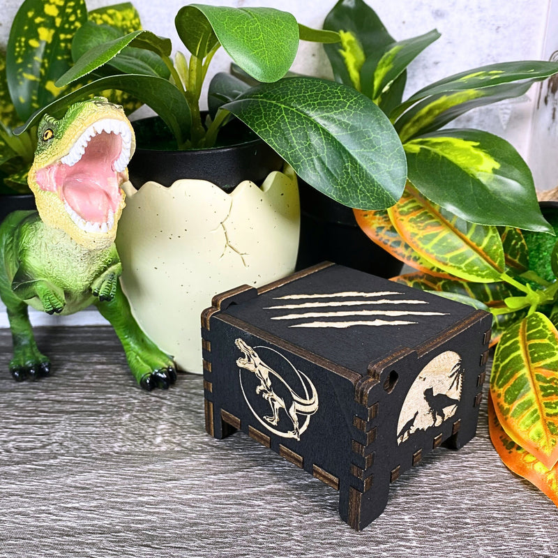 Load image into Gallery viewer, Jurassic Park: Join Alan Grant, Ellie Sattler, and Ian Malcolm on a tour of an island theme park filled with genetically resurrected dinosaurs. Get ready for an adventure with our iconic music box by MarketPlaceFad - Malaura Ashley.
