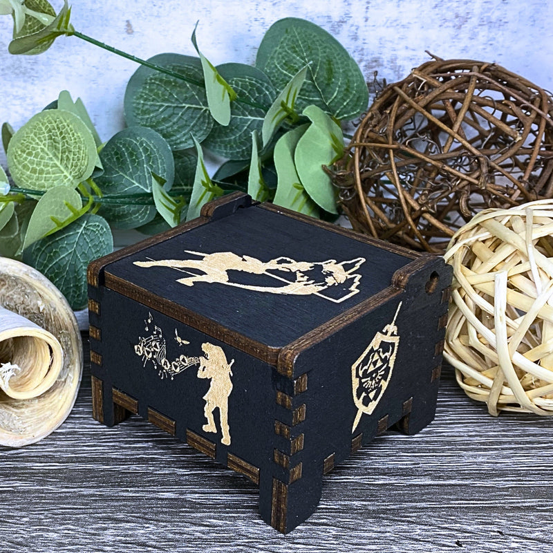 Load image into Gallery viewer, Are you looking for a one-of-a-kind gift for someone who adores Zelda? If so, you must check out the wooden music boxes at MarketPlacefad. These boxes are not just a source of melodious tunes but a work of art, handcrafted with attention to detail.
