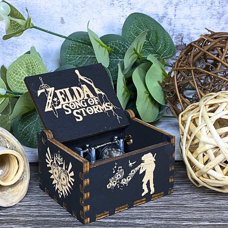 Load image into Gallery viewer, Are you looking for a one-of-a-kind gift for someone who adores Zelda? If so, you must check out the wooden music boxes at MarketPlacefad. These boxes are not just a source of melodious tunes but a work of art, handcrafted with attention to detail.
