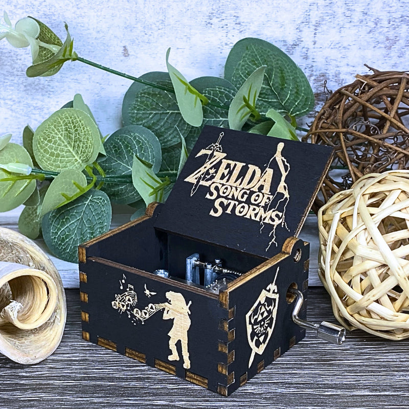 Load image into Gallery viewer, Are you looking for a one-of-a-kind gift for someone who adores Zelda? If so, you must check out the wooden music boxes at MarketPlacefad. These boxes are not just a source of melodious tunes but a work of art, handcrafted with attention to detail.
