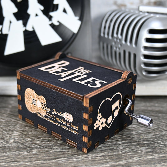 Immerse yourself in the classics of The Beatles as you listen to their legendary songs and lyrics emanating from the finely tuned wooden box. Each music box is a testament to the artistry and attention to detail, making it a perfect gift for anyone!