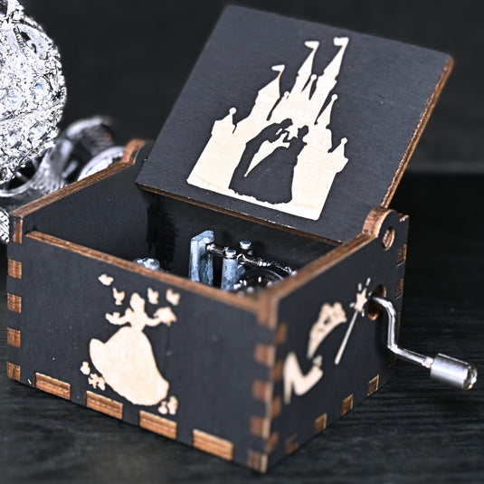 Experience the enchanting world of Cinderella with a music box that captures the tale in all its glory. As you turn the key, the sweet melody fills the air. This music box is a delightful treat for yourself or a loved one.