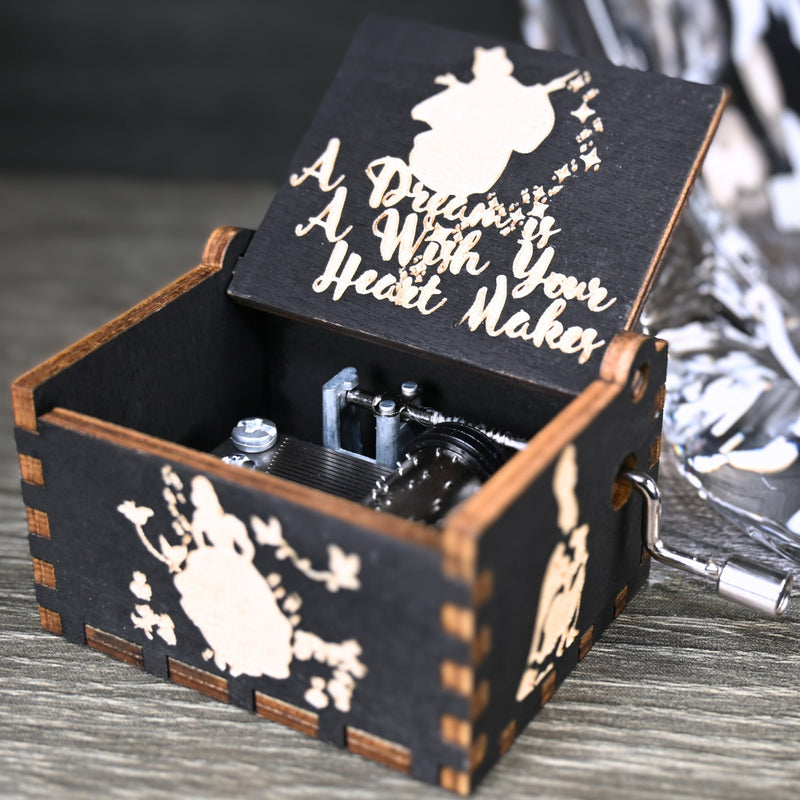 Load image into Gallery viewer, Experience the enchanting world of Cinderella with a music box that captures the tale in all its glory. As you turn the key, the sweet melody fills the air. This music box is a delightful treat for yourself or a loved one.
