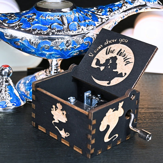 The Aladdin music box features intricate designs that capture the essence of the classic tale, including Aladdin and Princess Jasmine flying on the magic carpet. Its stunning design and enchanting melody make it the perfect gift for any occasion.