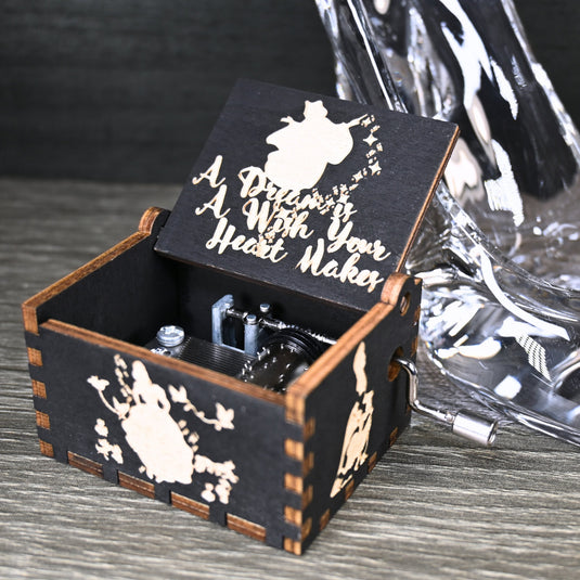 Experience the enchanting world of Cinderella with a music box that captures the tale in all its glory. As you turn the key, the sweet melody fills the air. This music box is a delightful treat for yourself or a loved one.