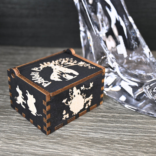 Experience the enchanting world of Cinderella with a music box that captures the tale in all its glory. As you turn the key, the sweet melody fills the air. This music box is a delightful treat for yourself or a loved one.
