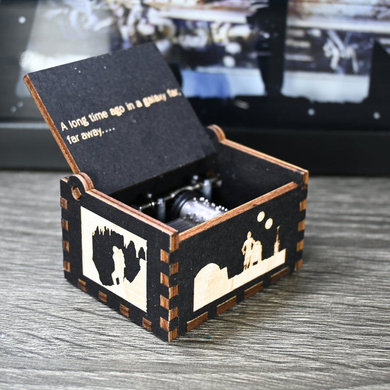 Load image into Gallery viewer, Are you a devoted follower of the Star Wars franchise? If so, you&#39;ll be thrilled to experience the excitement and adventure of your favorite movies in a whole new dimension with this exquisite music box. The box is masterfully handcrafted.
