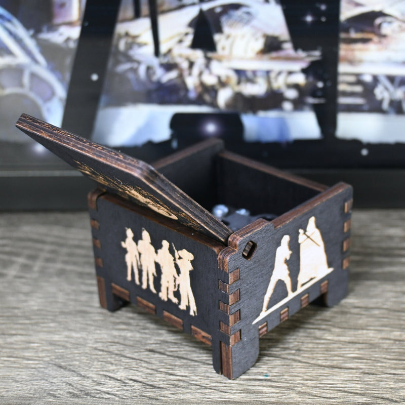 Load image into Gallery viewer, Are you a devoted follower of the Star Wars franchise? If so, you&#39;ll be thrilled to experience the excitement and adventure of your favorite movies in a whole new dimension with this exquisite music box. The box is masterfully handcrafted.
