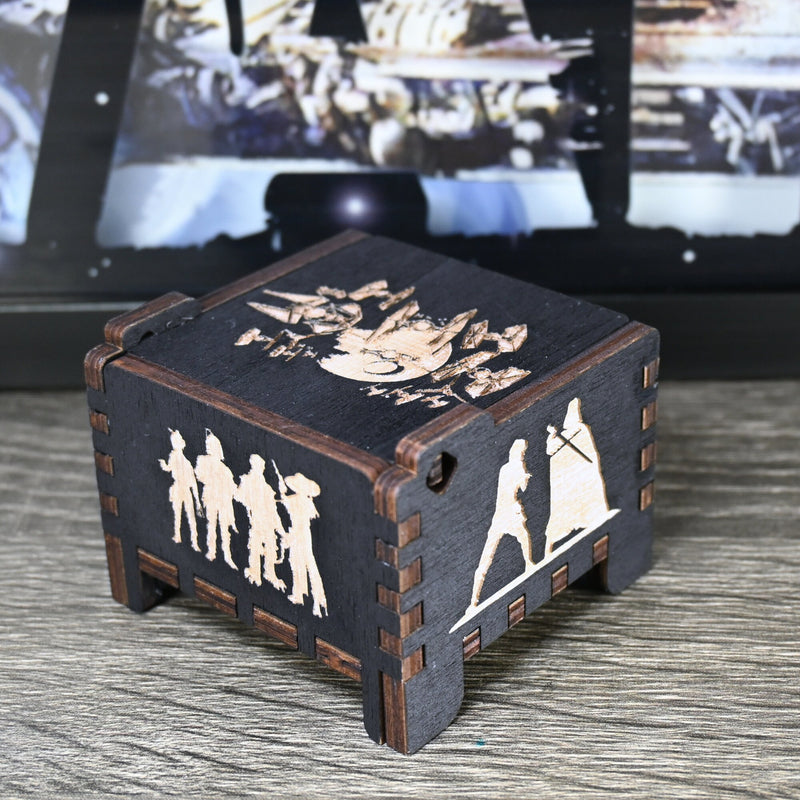 Load image into Gallery viewer, Are you a devoted follower of the Star Wars franchise? If so, you&#39;ll be thrilled to experience the excitement and adventure of your favorite movies in a whole new dimension with this exquisite music box. The box is masterfully handcrafted.
