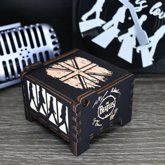 Immerse yourself in the classics of The Beatles as you listen to their legendary songs and lyrics emanating from the finely tuned wooden box. Each music box is a testament to the artistry and attention to detail, making it a perfect gift for anyone!