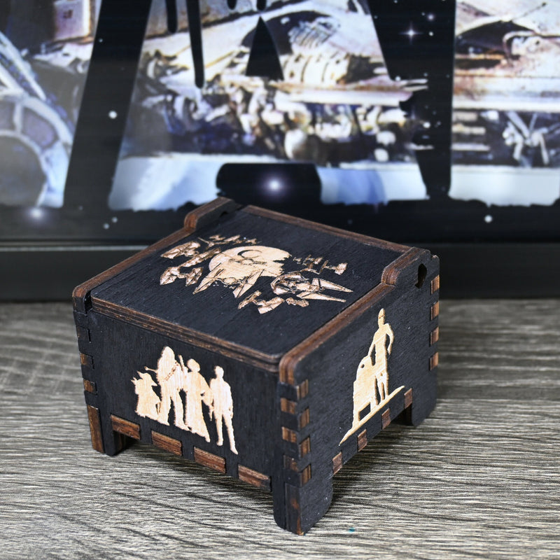Load image into Gallery viewer, Are you a devoted follower of the Star Wars franchise? If so, you&#39;ll be thrilled to experience the excitement and adventure of your favorite movies in a whole new dimension with this exquisite music box. The box is masterfully handcrafted.
