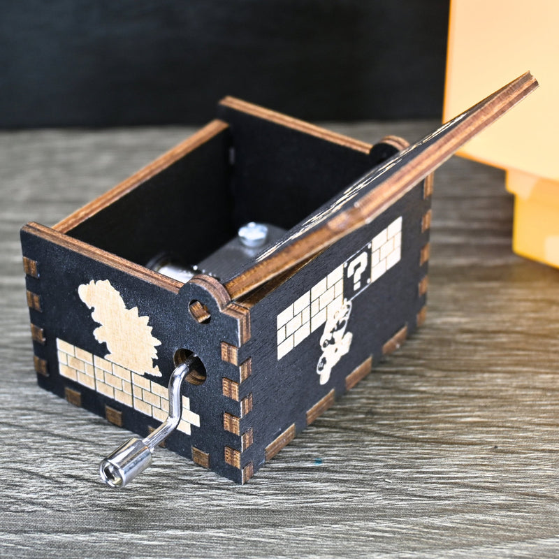 Load image into Gallery viewer, Enter the enchanting world of Mario with your very own music box! Embark on a thrilling adventure filled with excitement and challenges. Explore landscapes, overcome obstacles, and discover hidden treasures as you journey through this magical realm.
