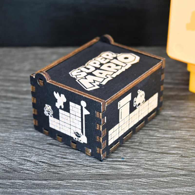 Load image into Gallery viewer, Enter the enchanting world of Mario with your very own music box! Embark on a thrilling adventure filled with excitement and challenges. Explore landscapes, overcome obstacles, and discover hidden treasures as you journey through this magical realm.
