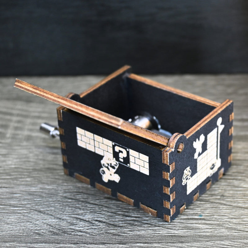 Load image into Gallery viewer, Enter the enchanting world of Mario with your very own music box! Embark on a thrilling adventure filled with excitement and challenges. Explore landscapes, overcome obstacles, and discover hidden treasures as you journey through this magical realm.
