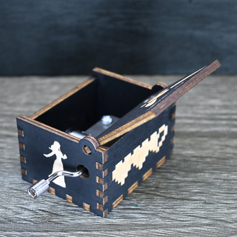 Load image into Gallery viewer, Are you looking for a one-of-a-kind gift for someone who adores Zelda? If so, you must check out the wooden music boxes at MarketPlacefad. These boxes are not just a source of melodious tunes but a work of art, handcrafted with attention to detail.
