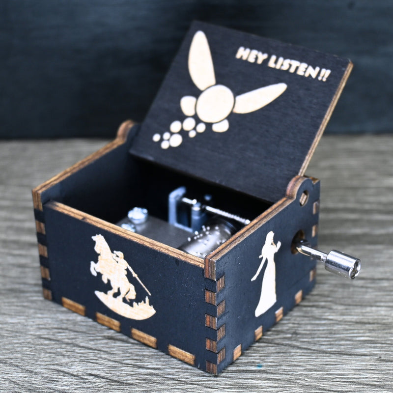 Load image into Gallery viewer, Are you looking for a one-of-a-kind gift for someone who adores Zelda? If so, you must check out the wooden music boxes at MarketPlacefad. These boxes are not just a source of melodious tunes but a work of art, handcrafted with attention to detail.
