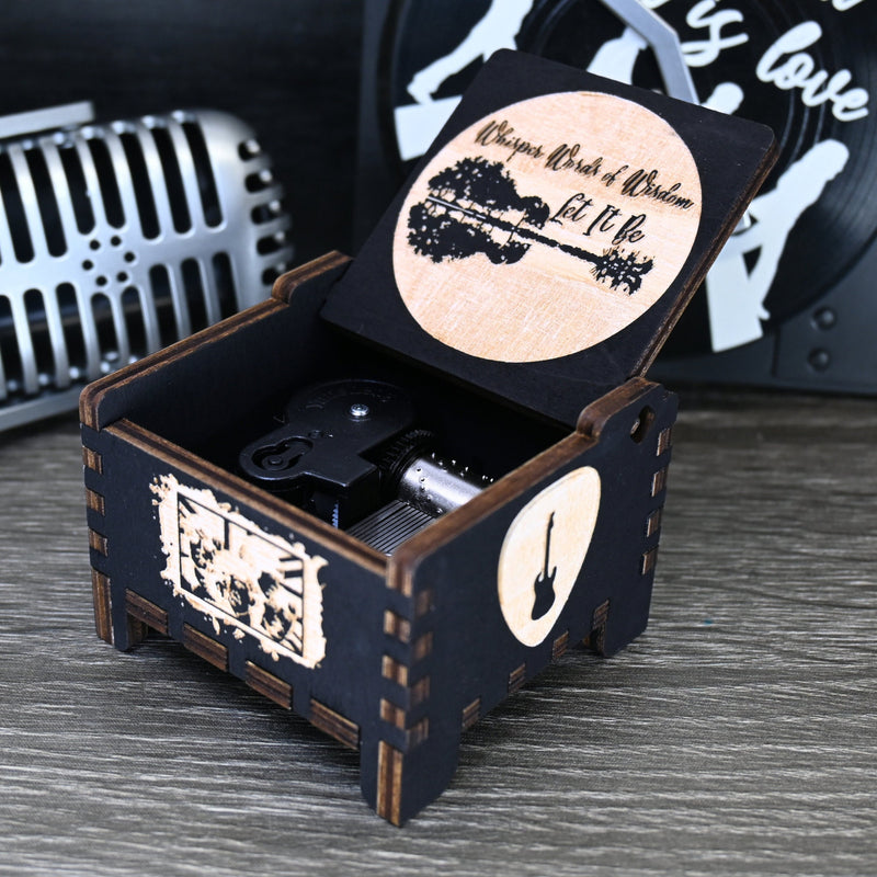 Load image into Gallery viewer, Immerse yourself in the classics of The Beatles as you listen to their legendary songs and lyrics emanating from the finely tuned wooden box. Each music box is a testament to the artistry and attention to detail, making it a perfect gift for anyone!
