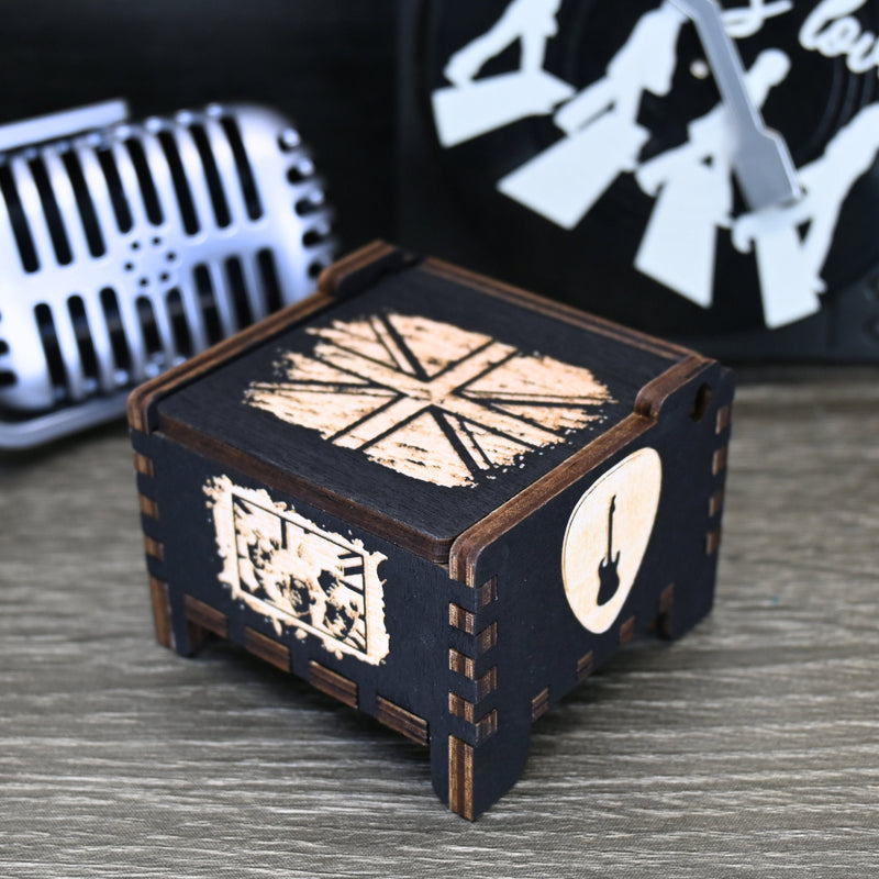 Load image into Gallery viewer, Immerse yourself in the classics of The Beatles as you listen to their legendary songs and lyrics emanating from the finely tuned wooden box. Each music box is a testament to the artistry and attention to detail, making it a perfect gift for anyone!
