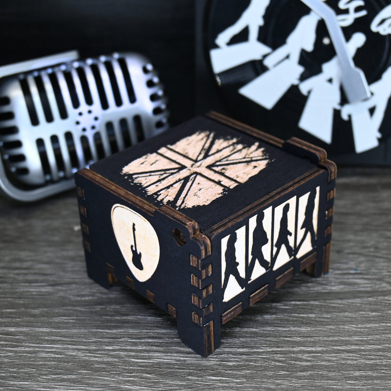 Load image into Gallery viewer, Immerse yourself in the classics of The Beatles as you listen to their legendary songs and lyrics emanating from the finely tuned wooden box. Each music box is a testament to the artistry and attention to detail, making it a perfect gift for anyone!
