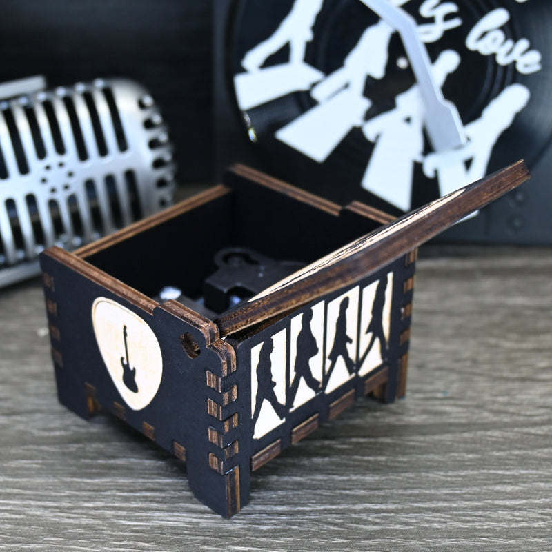 Load image into Gallery viewer, Immerse yourself in the classics of The Beatles as you listen to their legendary songs and lyrics emanating from the finely tuned wooden box. Each music box is a testament to the artistry and attention to detail, making it a perfect gift for anyone!
