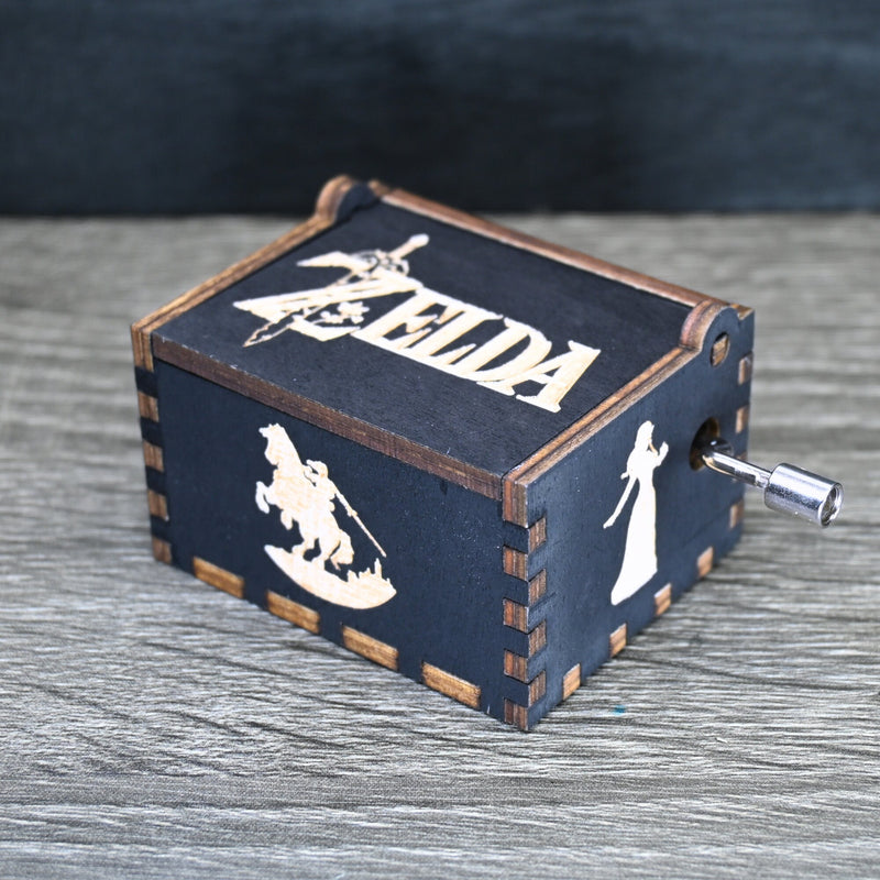 Load image into Gallery viewer, Are you looking for a one-of-a-kind gift for someone who adores Zelda? If so, you must check out the wooden music boxes at MarketPlacefad. These boxes are not just a source of melodious tunes but a work of art, handcrafted with attention to detail.
