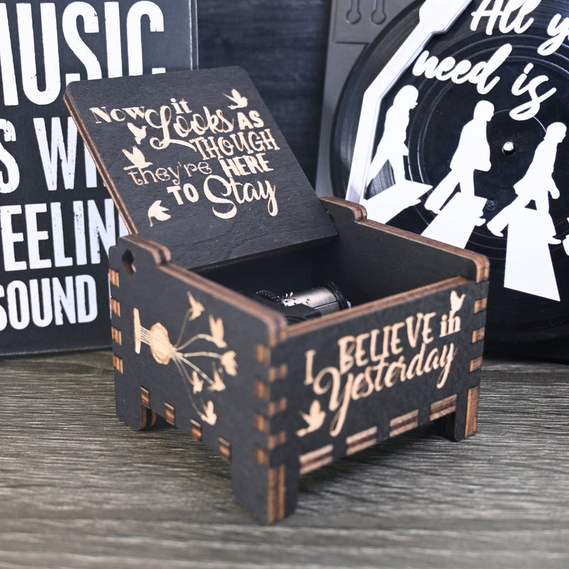 Load image into Gallery viewer, Immerse yourself in the classics of The Beatles as you listen to their legendary songs and lyrics emanating from the finely tuned wooden box. Each music box is a testament to the artistry and attention to detail, making it a perfect gift for anyone!
