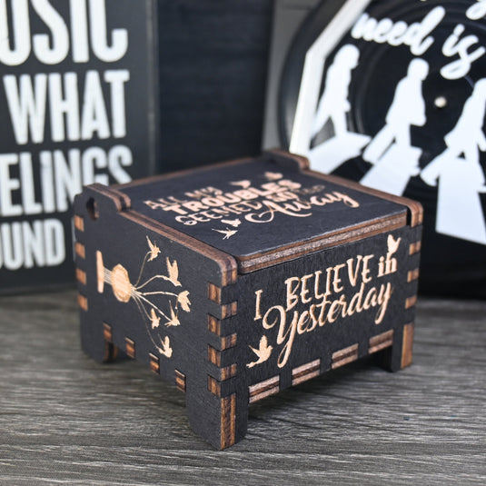 Immerse yourself in the classics of The Beatles as you listen to their legendary songs and lyrics emanating from the finely tuned wooden box. Each music box is a testament to the artistry and attention to detail, making it a perfect gift for anyone!