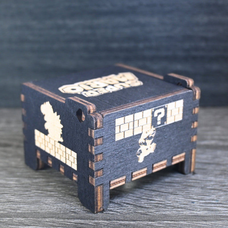 Load image into Gallery viewer, Enter the enchanting world of Mario with your very own music box! Embark on a thrilling adventure filled with excitement and challenges. Explore landscapes, overcome obstacles, and discover hidden treasures as you journey through this magical realm.
